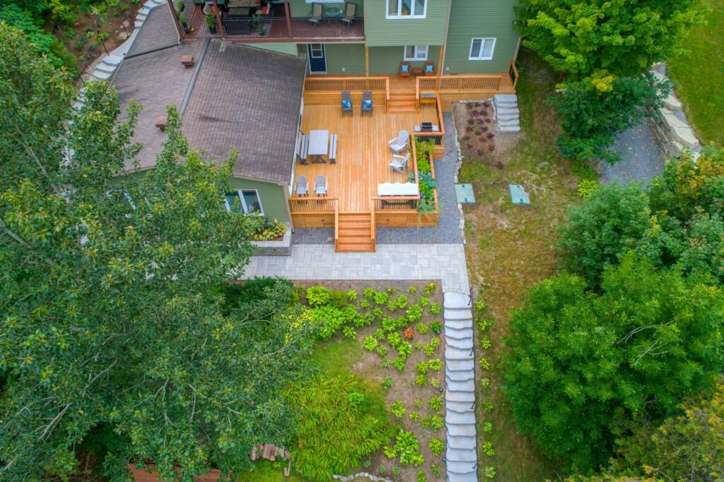 CrystalCrest Inc team revamping the garden for a backyard campfire site